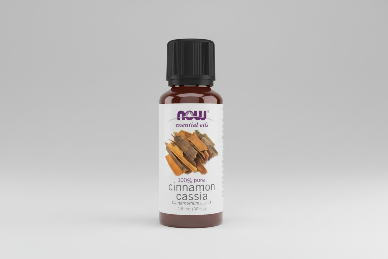 Bottle of NOW Essential Oils Cinnamon Cassia oil on a white background