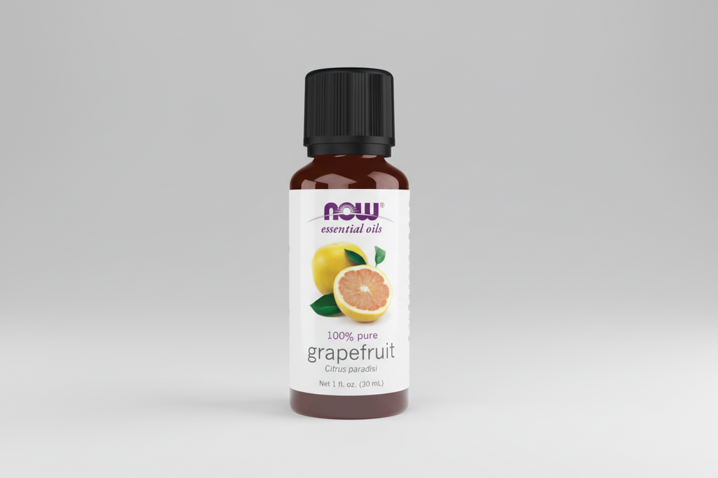 Bottle of Now Essential Oils grapefruit oil on a white background