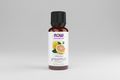 Bottle of Now Essential Oils grapefruit oil on a white background