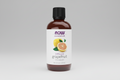 Bottle of NOW essential oils with grapefruit flavor on a white background