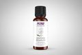 Bottle of NOW Jasmine Absolute essential oil on a white background