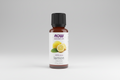 Bottle of NOW lemon essential oil on a white background
