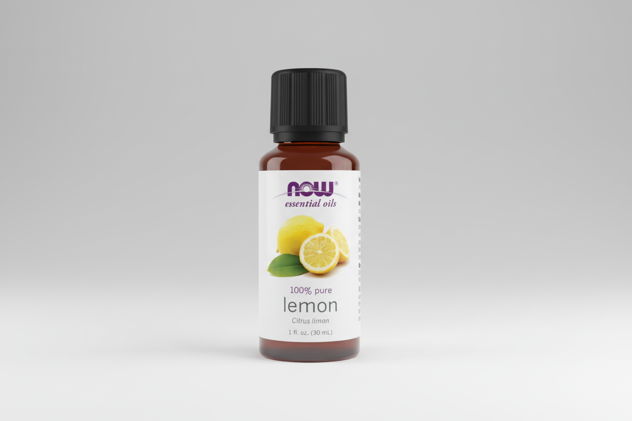 Bottle of NOW lemon essential oil on a white background