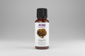 Bottle of NOW Myrrh essential oil blend on a white background