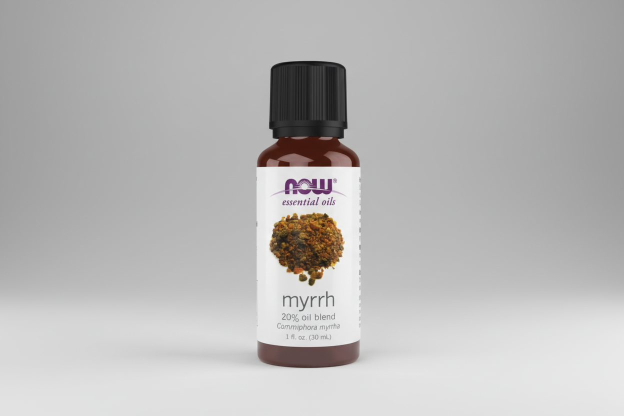 Bottle of NOW Myrrh essential oil blend on a white background