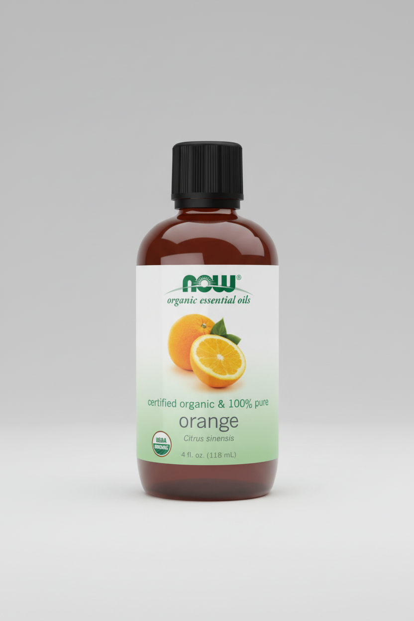 Bottle of NOW Organic Essential Oils with orange on a white background