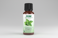 Bottle of NOW Oregano essential oil on a white background