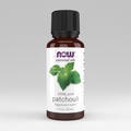 Bottle of NOW Essential Oils Patchouli oil on a white background