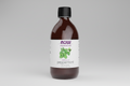 Bottle of peppermint essential oil with a NOW Foods label on a white background