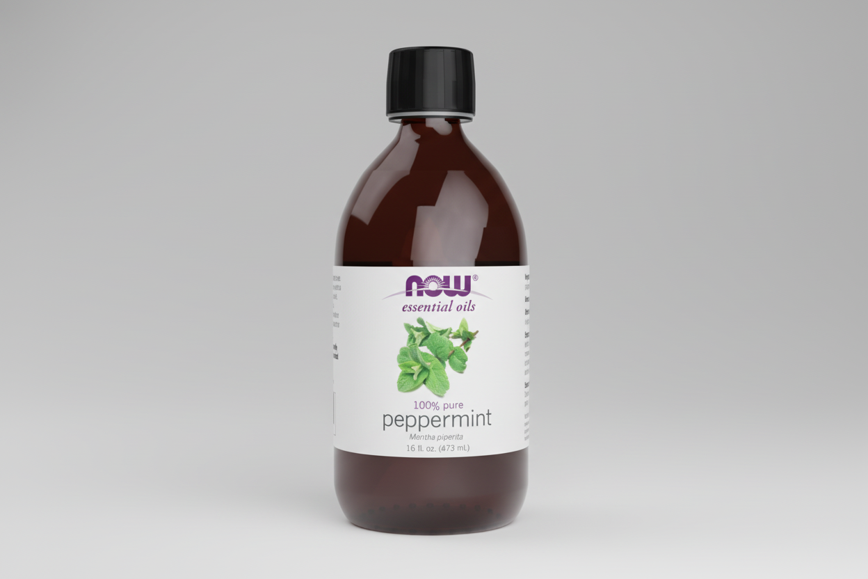 Bottle of peppermint essential oil with a NOW Foods label on a white background