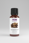 Sandalwood essential oil bottle with NOW brand on a white background