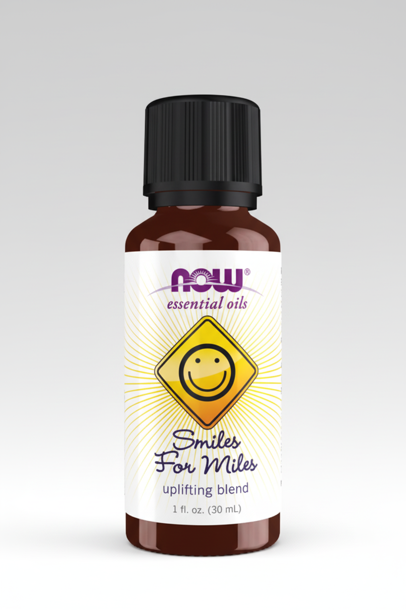 Bottle of NOW Essential Oils 'Smiles For Miles' on a white background