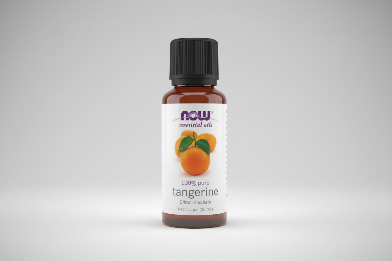 Bottle of Now Essential Oils tangerine oil on a white background