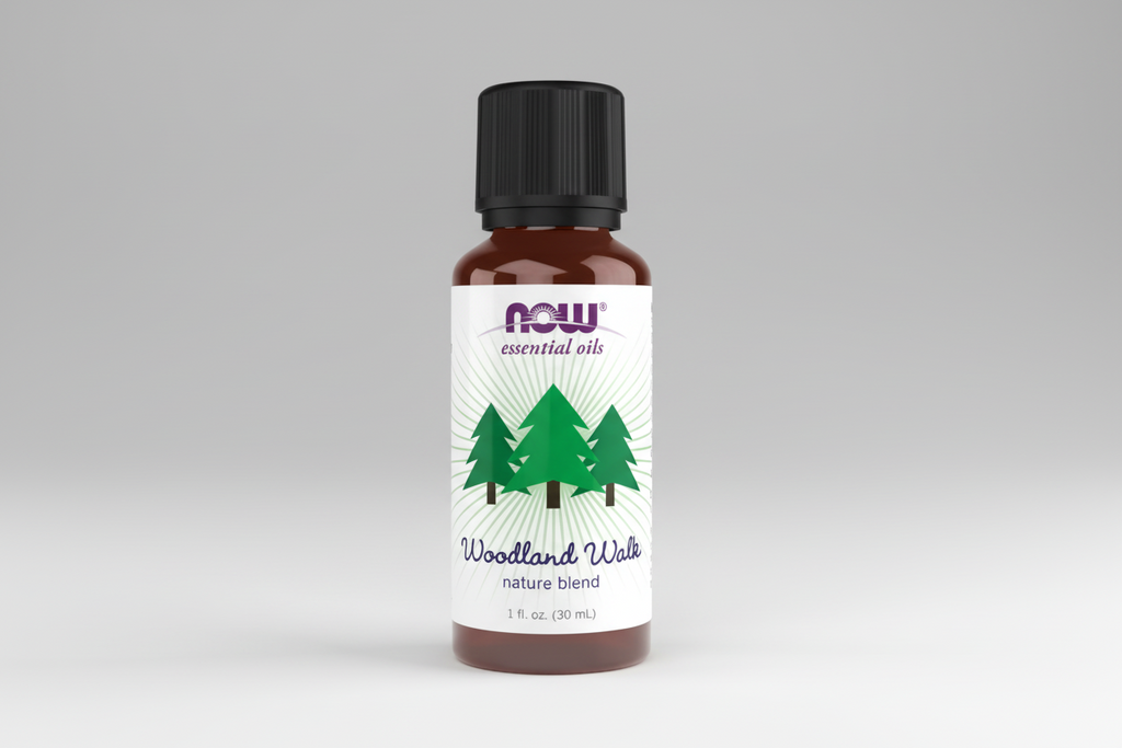 Bottle of NOW Essential Oils Woodland Walk nature blend on a white background