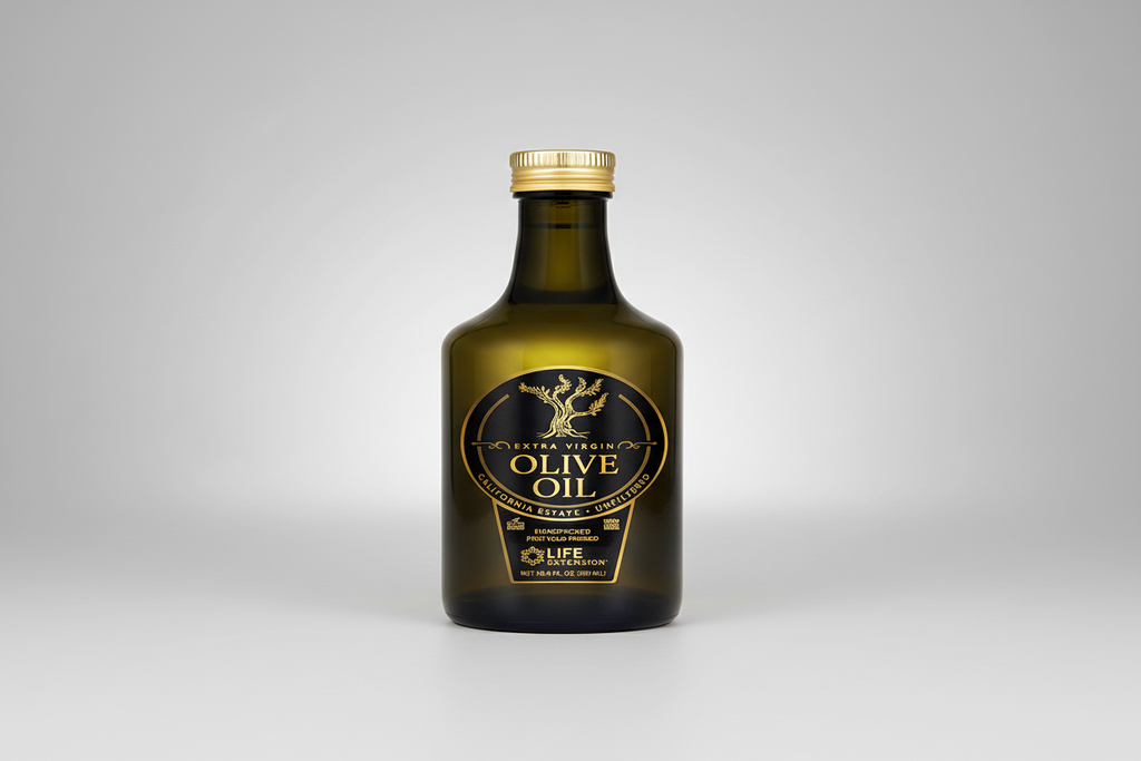 Bottle of olive oil with a gold cap on a white background