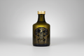 Bottle of olive oil with a gold cap on a white background