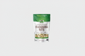 Bag of dry roasted and sea salted macadamia nuts on a white background