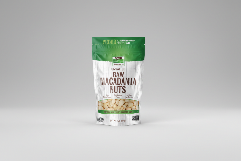 Bag of unsalted raw macadamia nuts on a white background
