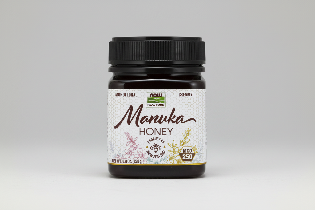 Jar of Manuka Honey with a black lid on a white background