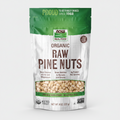 Bag of organic raw pine nuts with NOW Real Food branding on a white background