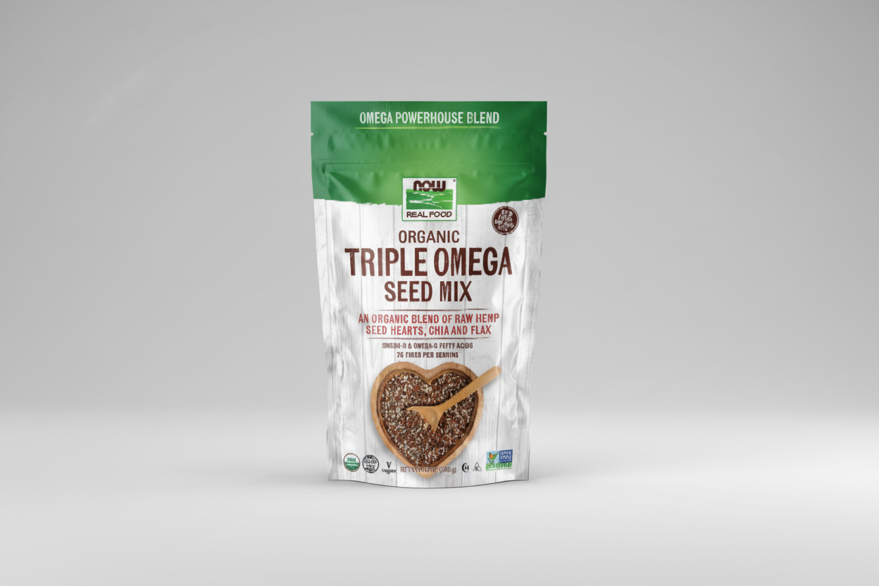 Package of NOW Organic Triple Omega Seed Mix with a wooden spoon on a white background
