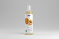 Bottle of NOW Solutions apricot oil on a white background