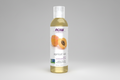 Bottle of NOW Solutions apricot oil on a white background