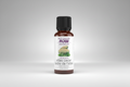 Bottle of atlas cedar essential oil with NOW brand on a white background