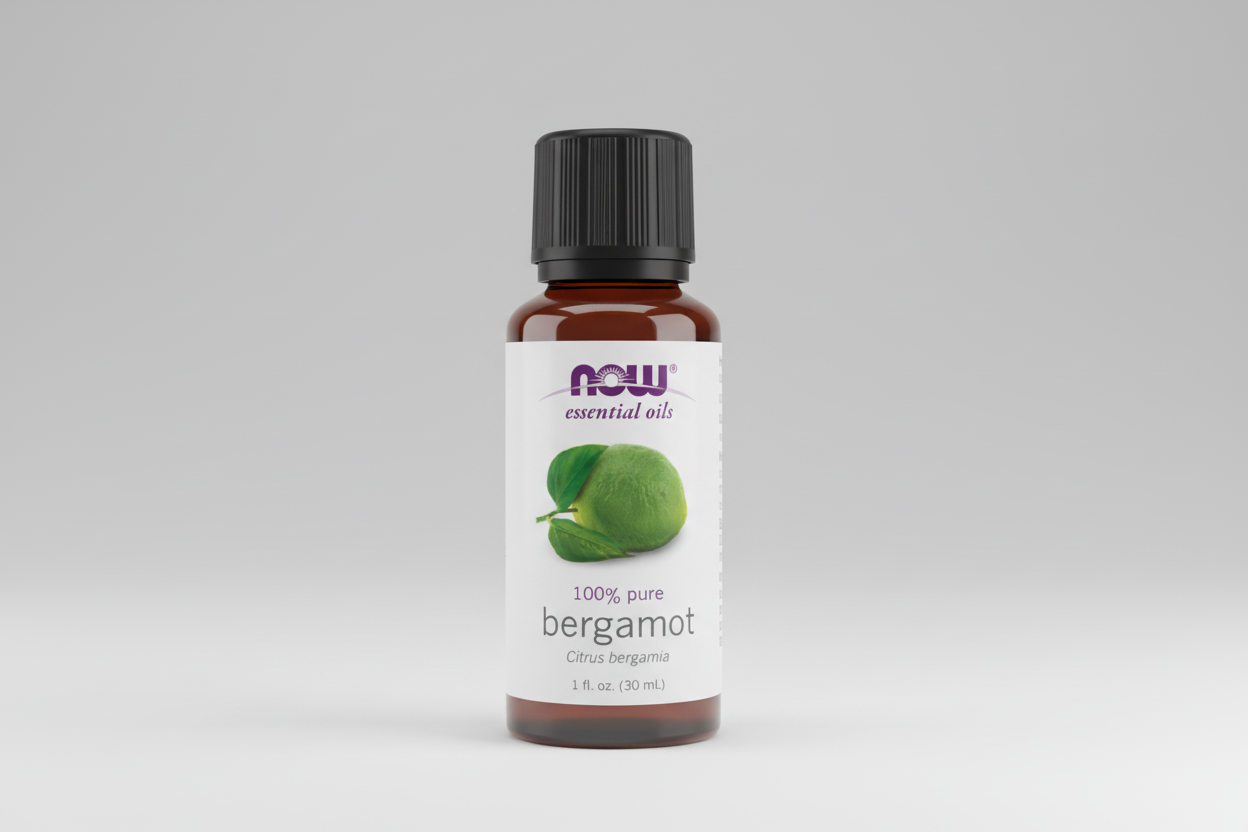 Bottle of NOW Essential Oils bergamot oil on a white background