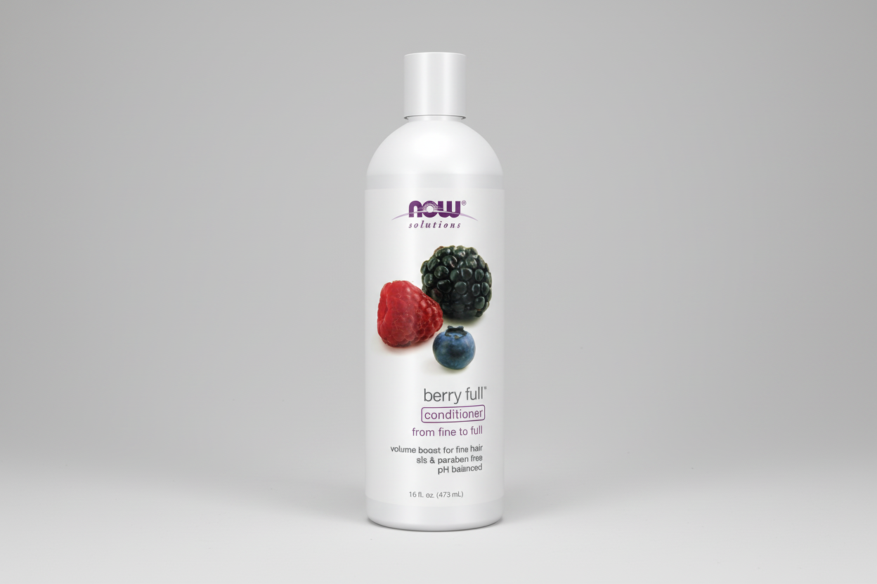Bottle of NOW Solutions berry full conditioner on a white background