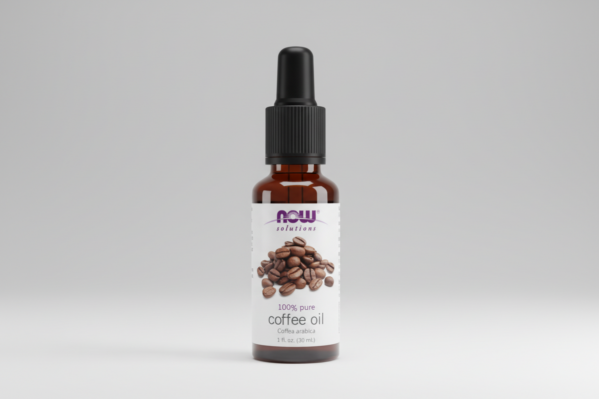 Bottle of NOW Solutions 100% pure coffee oil on a white background