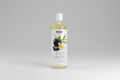 Bottle of Now Solutions comforting massage oil with a white background