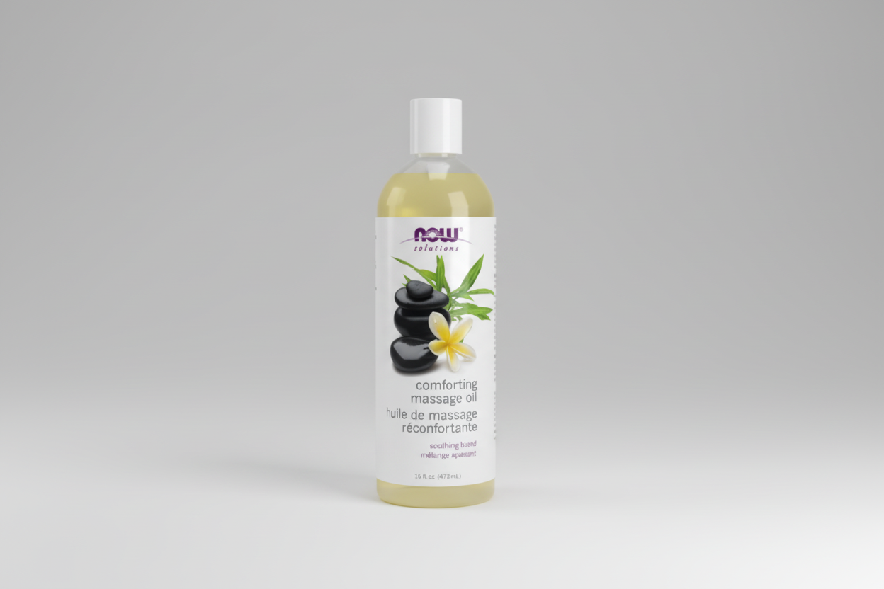 Bottle of Now Solutions comforting massage oil with a white background