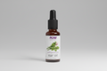 Bottle of NOW Solutions ear oil on a white background