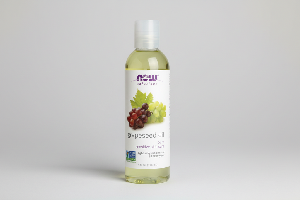 Bottle of NOW Solutions grapeseed oil on a white background