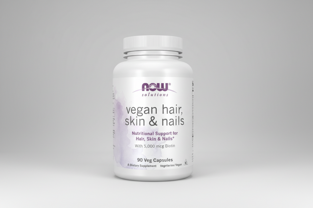 Supplement bottle labeled 'vegan hair, skin & nails' with NOW Solutions branding on a white background.