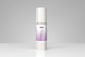 Skincare bottle with a white and purple label on a white background