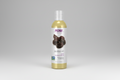 Bottle of NOW Solutions jojoba oil on a white background