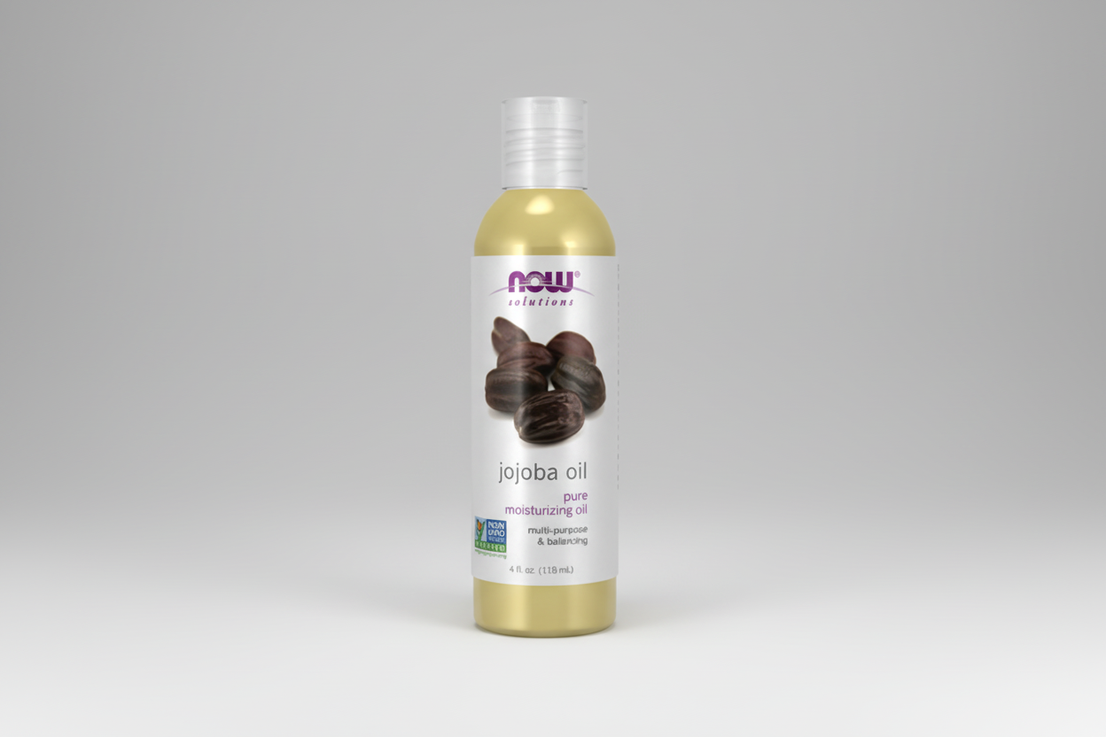 Bottle of NOW Solutions jojoba oil on a white background