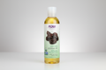 Bottle of NOW Solutions jojoba oil on a white background