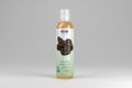 Bottle of NOW Solutions certified organic jojoba oil on a white background