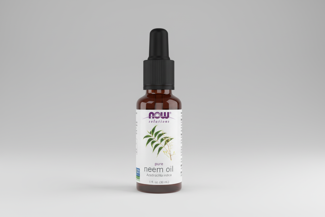 Bottle of NOW Solutions pure neem oil on a white background