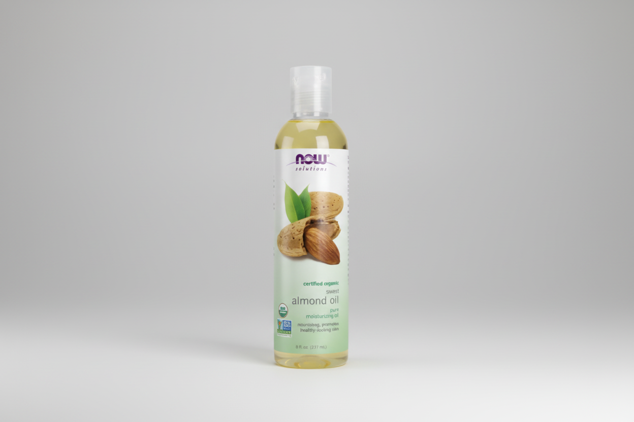 Bottle of NOW Solutions almond oil on a white background