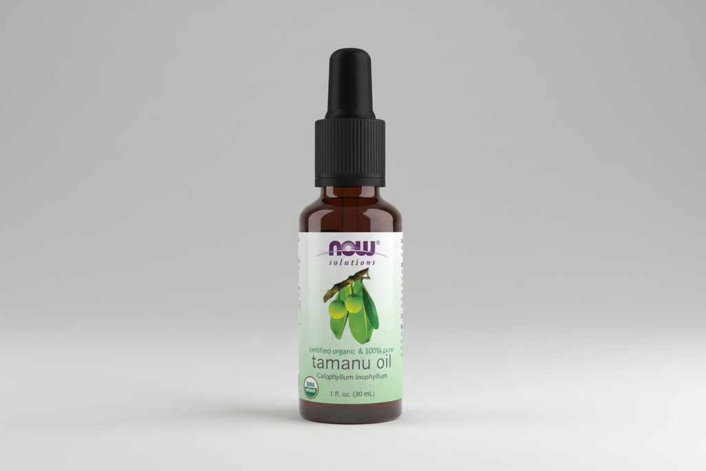 Bottle of NOW Solutions tamanu oil on a white background
