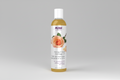 Bottle of NOW Solutions Tranquil Rose Massage Oil on a white background