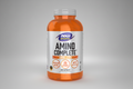 Orange supplement bottle labeled 'Amino Complete' by NOW Sports on a white background