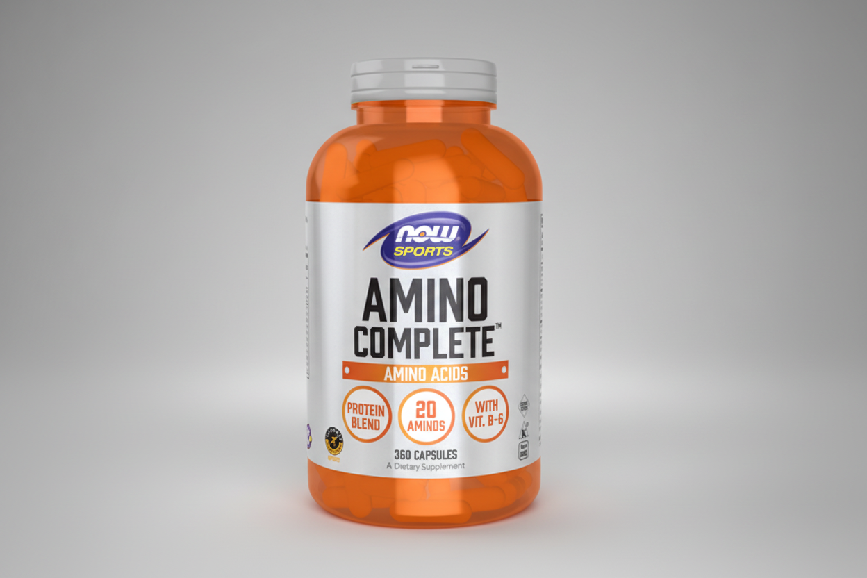 Orange supplement bottle labeled 'Amino Complete' by NOW Sports on a white background