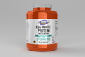 Orange protein powder container with white label on a white background