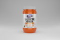Orange and white container of L-Leucine Powder by NOW Sports on a white background