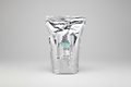 Clear bag of whey protein powder with a label on a white background